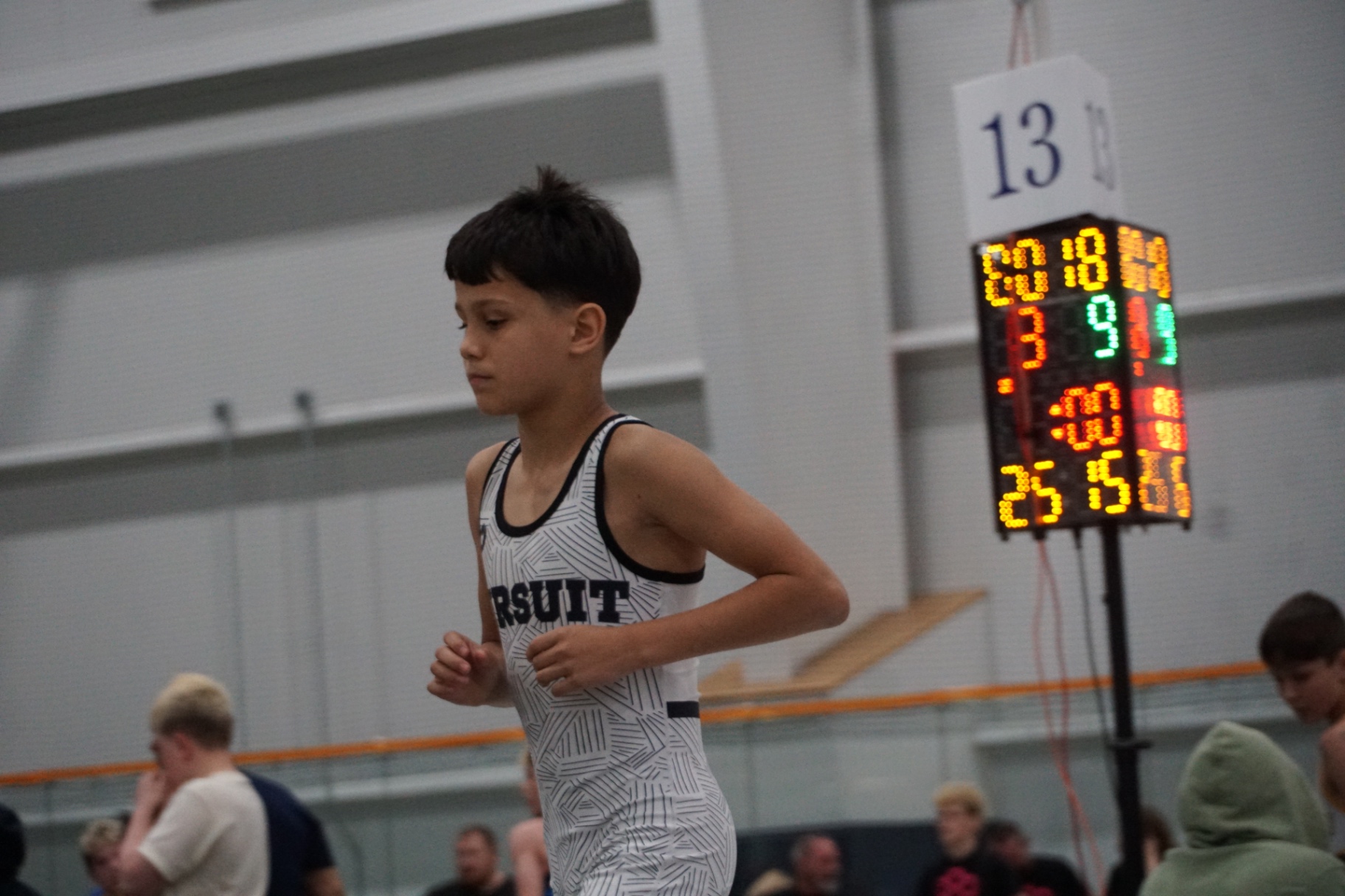 Young wrestler entering the mat area